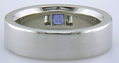 Custom platinum band with burnish set sapphires and diamonds.