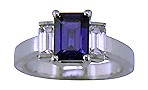 Emerald cut sapphire and diamond ring in platinum.