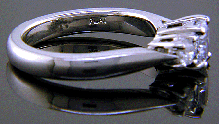 Blue diamond ring with platinum (PLAT) hallmark.