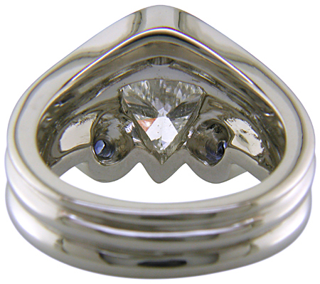Inside view of trilliant diamond ring with three small sapphires.