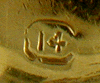 Close up of makers mark on back of cufflinks.