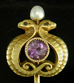 Antique stickpin of entwined serpents guarding an amethyst. (J9083)