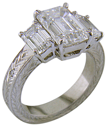 Three Emerald-cut Diamonds in a custom platinum ring.