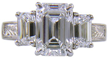 Three Emerald-cut Diamonds in a custom platinum ring.