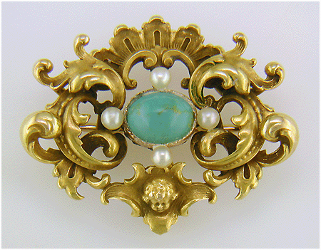 Victorian gold brooch in the ornate Rococo Revival style. (J8460)