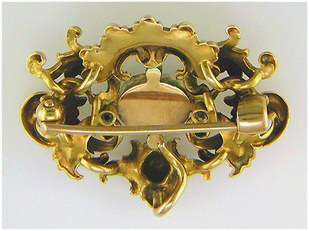 Victorian gold brooch in the ornate Rococo Revival style. (J8460)