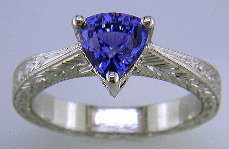 Platinum hand-engraved ring with trillium color change sapphire.