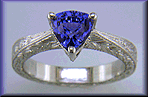 Platinum hand-engraved ring with trillium color change sapphire.