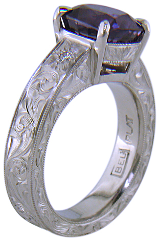 Custom hand-engraved platinum ring with Sapphire.