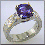 Custom hand-engraved platinum ring with Sapphire.
