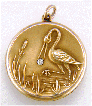 Victorian 14kt gold locket with a crane clutching a diamond in its beak. (J8639)