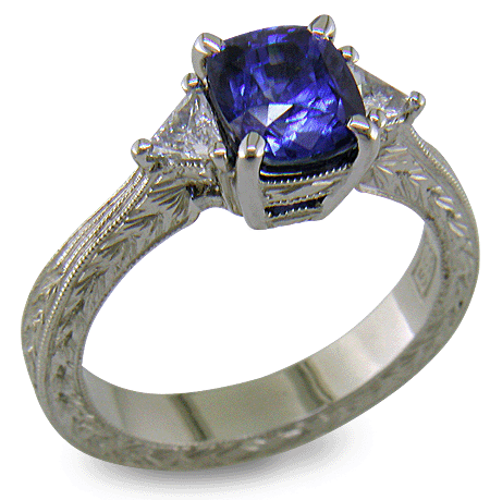 Cushion Sapphire ring with trilliant diamond and hand engraved platinum. (J8750)