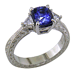 Cushion Sapphire ring with trilliant diamond and hand engraved platinum. (J8750)