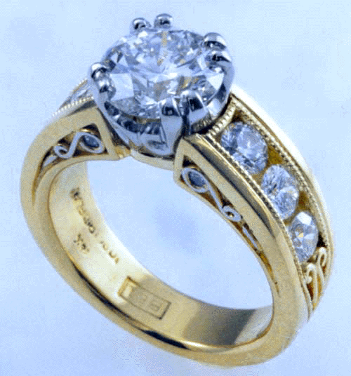 Ideal cut diamond set in custom designed engagement ring.