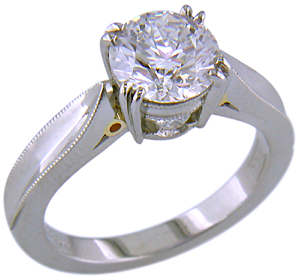 Platinum diamond ring with 18kt gold accents.
