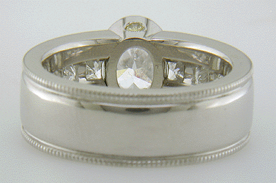 Inside view of oval diamond ring with Princess-cut side diamonds.