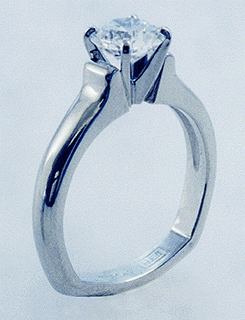 Diamond solitaire engagement ring hand crafted in platinum.