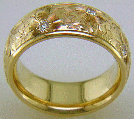 Hand engraved yellow gold band with diamonds