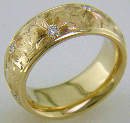 Hand engraved yellow gold band with diamonds.
