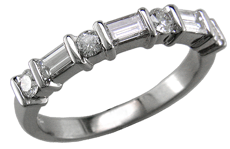 Platinum wedding band with round and baguette diamonds.