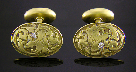 Dragon cufflinks set with small diamonds. (J9048)