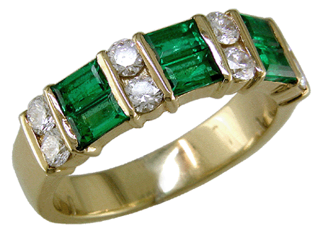 18kt gold band with emeralds and diamonds.