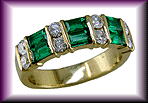 18kt gold band with emeralds and diamonds.