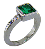 1.6-carat emerald set with round brilliant-cut diamonds in a custom platinum ring.