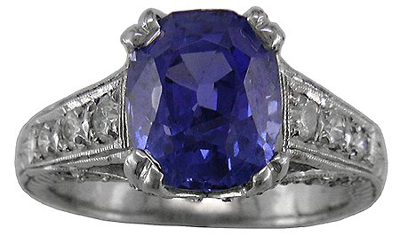 Striking estate sapphire ring with diamonds.