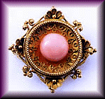 Etruscan Revival pin with coral cabochon.
