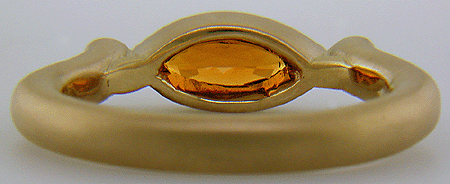 Inside of 18kt gold ring with a Spessartite garnet and diamonds. (J6421)