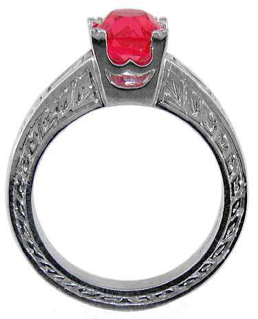 Side view of platinum ring with flame red spinel and baguette diamonds.