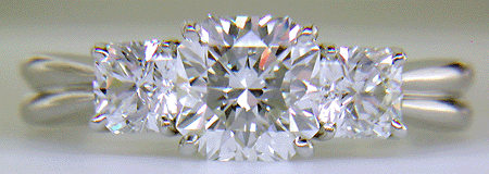Three Flanders cut diamonds in a custom platinum ring.