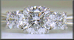 Three Flanders cut diamonds in a custom platinum ring.