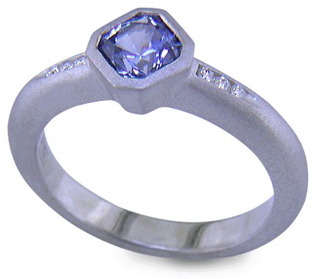Flanders-cut Sapphire with round diamonds in a custom platinum ring. (J8538)