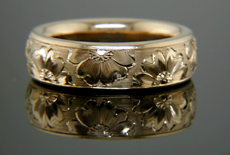 14kt gold band with hand engraved woodland flowers.