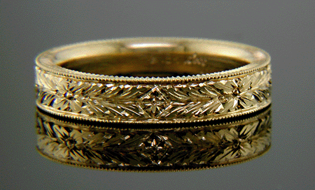 18kt gold band with hand engraved laurels.