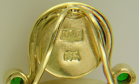 Close up of Bijoux Extraodinaire hallmark.