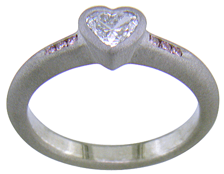 Heart-shape Diamond with round Fancy Vivid Pink Diamonds in a custom platinum ring. (J8414)