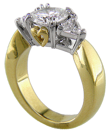 Side view of three-stone diamond engagement ring crafted in 18kt gold and platinum with hidden hearts.