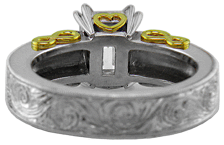 Inside view of hand-engraved platinum and gold ring with an emerald cut diamond.