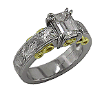 Hand-engraved platinum and gold rings with an emerald cut diamond.