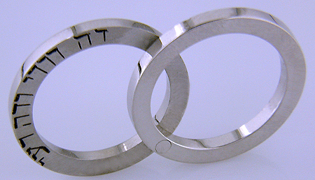 Hebrew inscription in custom wedding bands.