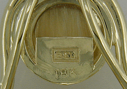 Close up of Bijoux Extraodinaire hallmark.