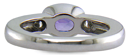 Inside view of violet sapphire ring with trilliant diamonds crafted in platinum. (J7238)