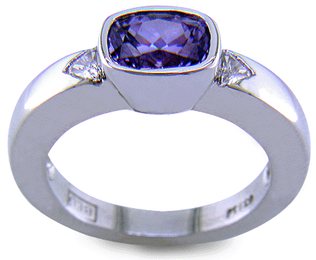 Side view of violet sapphire ring with trilliant diamonds crafted in platinum. (J7238)