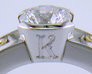 Close-up of hand engraved 'K'.