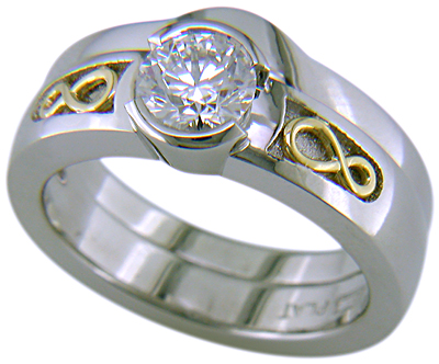 Custom platinum diamond ring with matching contoured wedding band.