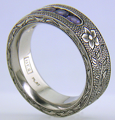 Hand-engraved platinum band with engraved laurel flowers.
