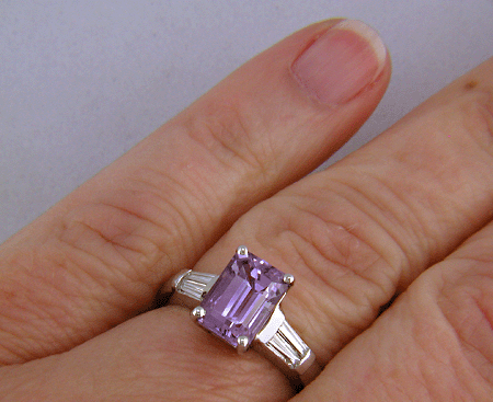 Lavender Sapphire set with tapered baguette diamonds in a handcrafted platinum ring.